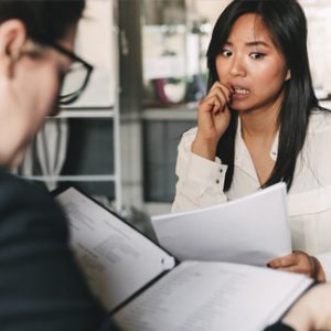 Applicant bites nails as she gets nervous during the interview